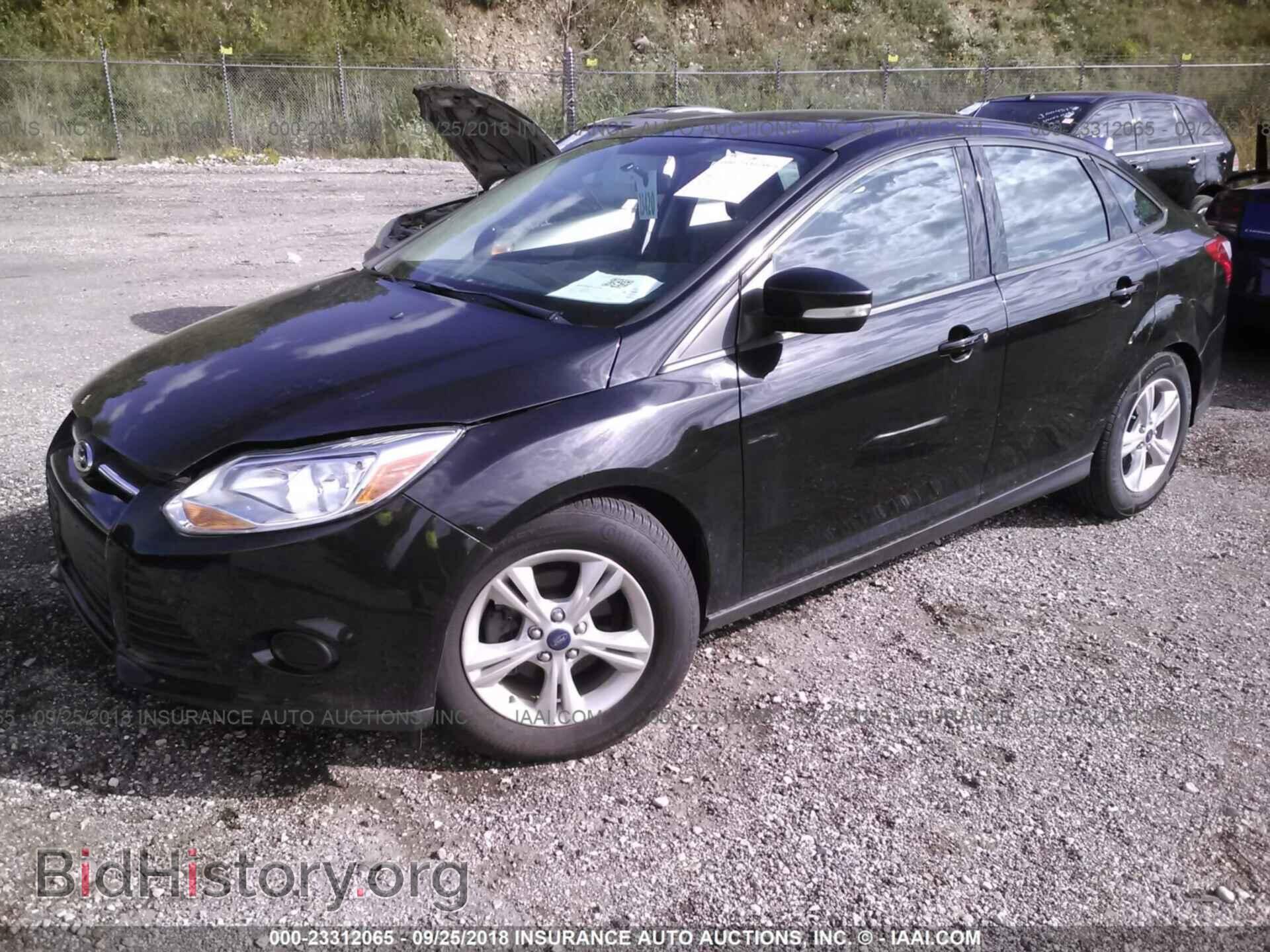 2014 Ford Focus - VIN: 1FADP3F29EL310165 - Фото 2