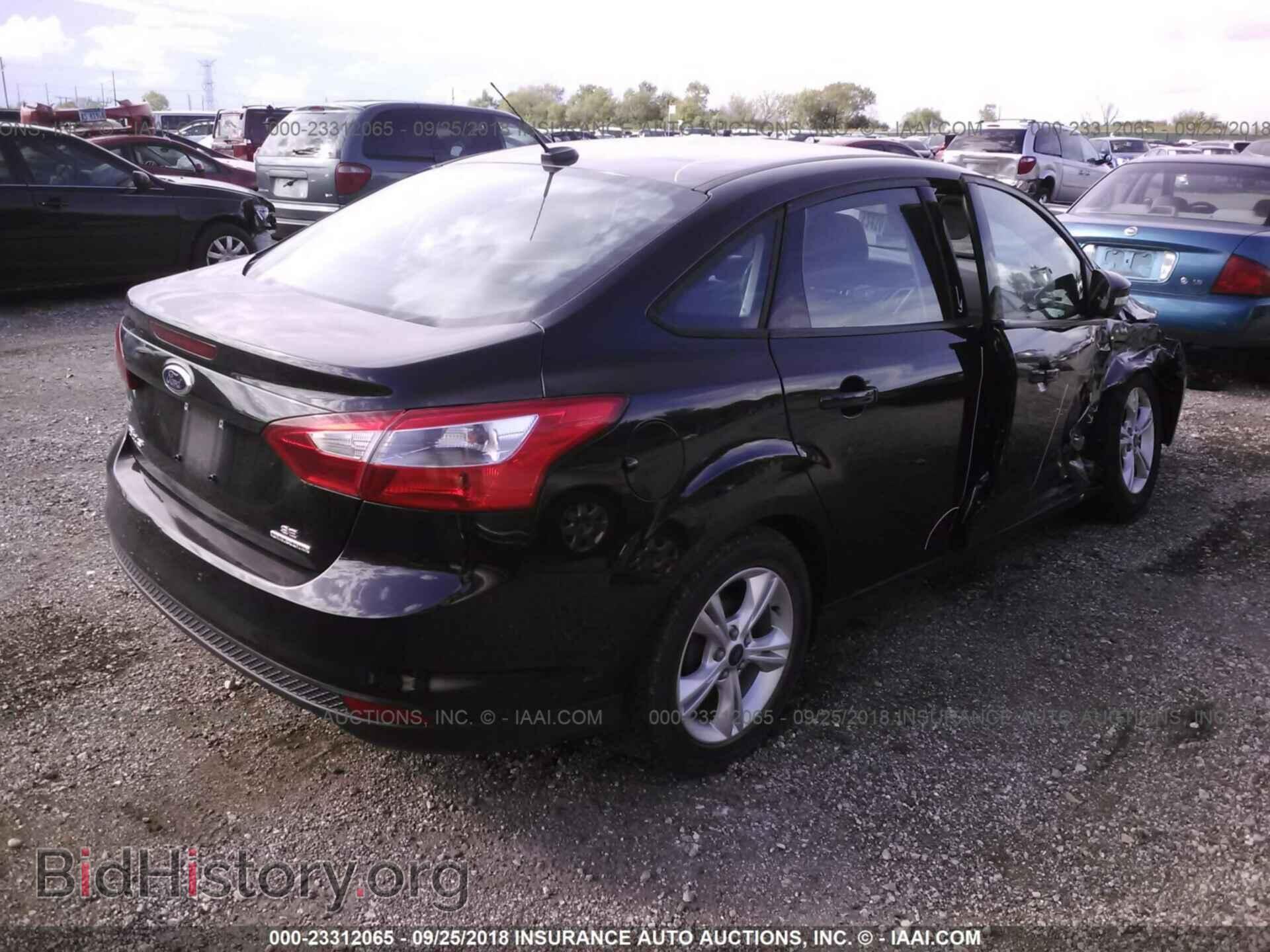 2014 Ford Focus - VIN: 1FADP3F29EL310165 - Фото 4
