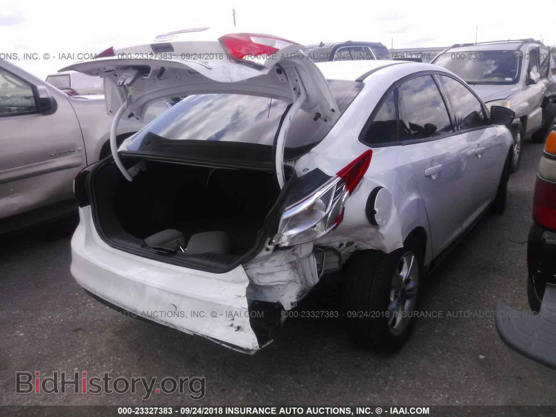 2014 Ford Focus - VIN: 1FADP3F20EL155554 - Фото 4