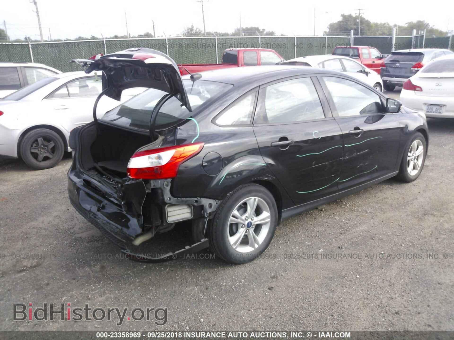 2014 Ford Focus - VIN: 1FADP3F24EL218736 - Photo 4