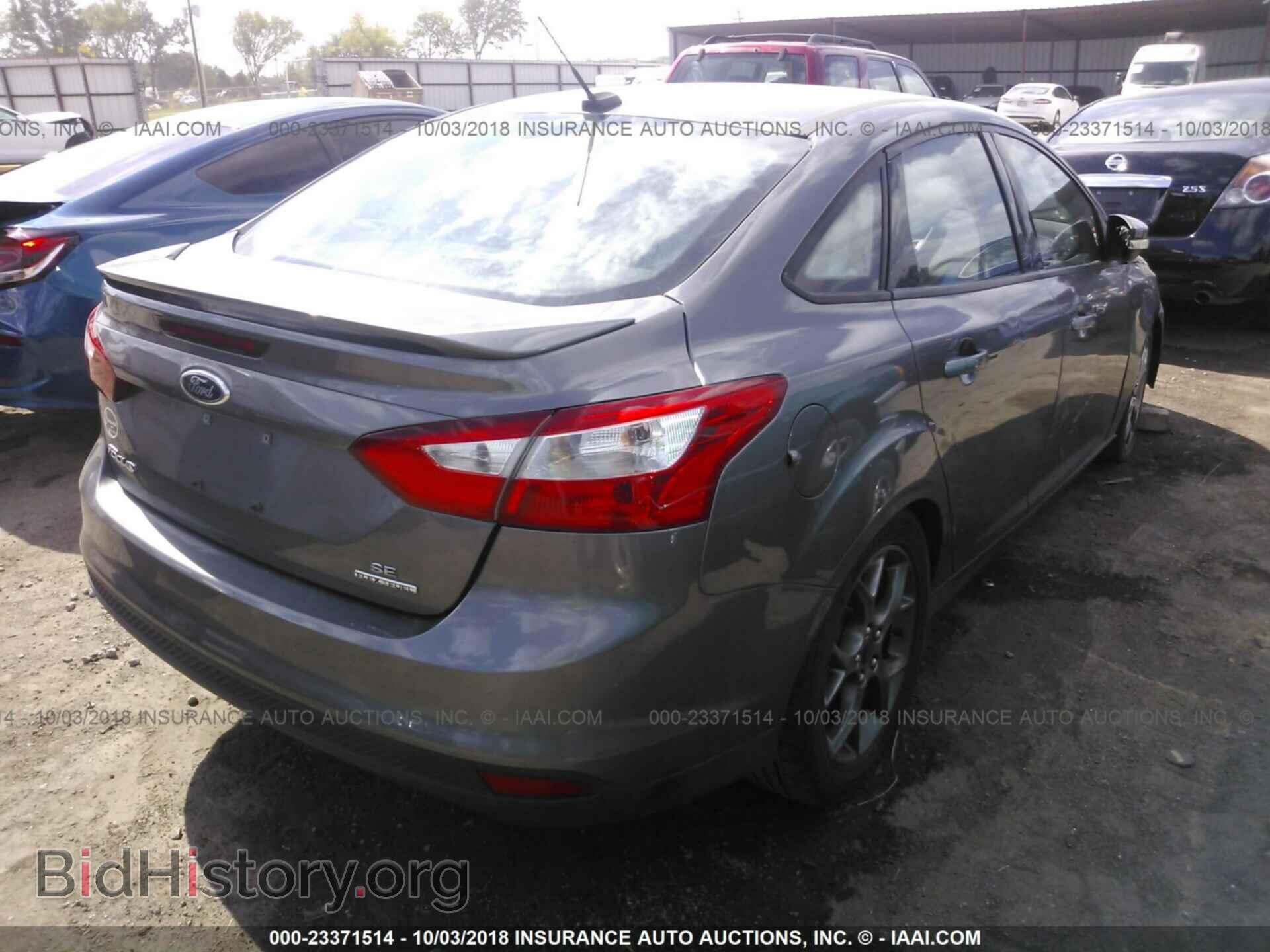 2014 Ford Focus - VIN: 1FADP3F24EL218560 - Фото 4