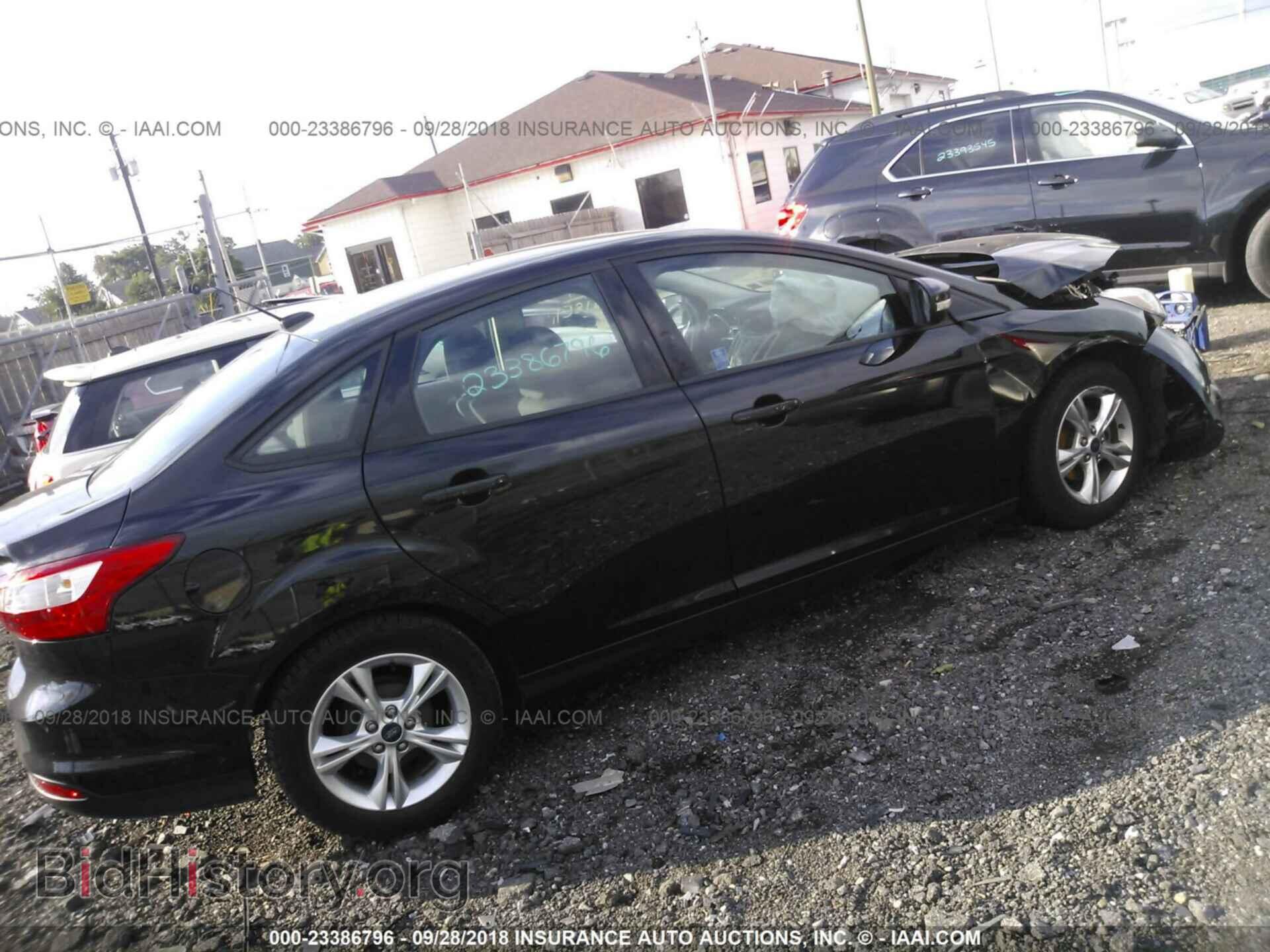 2014 Ford Focus - VIN: 1FADP3F2XEL245097 - Photo 4