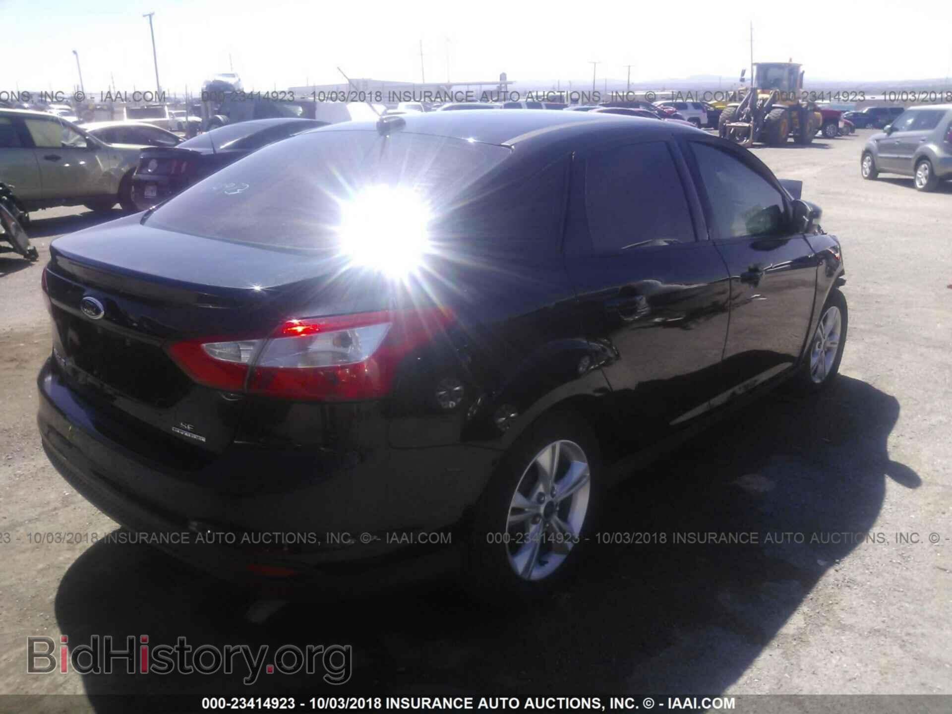 2014 Ford Focus - VIN: 1FADP3F22EL372720 - Фото 4