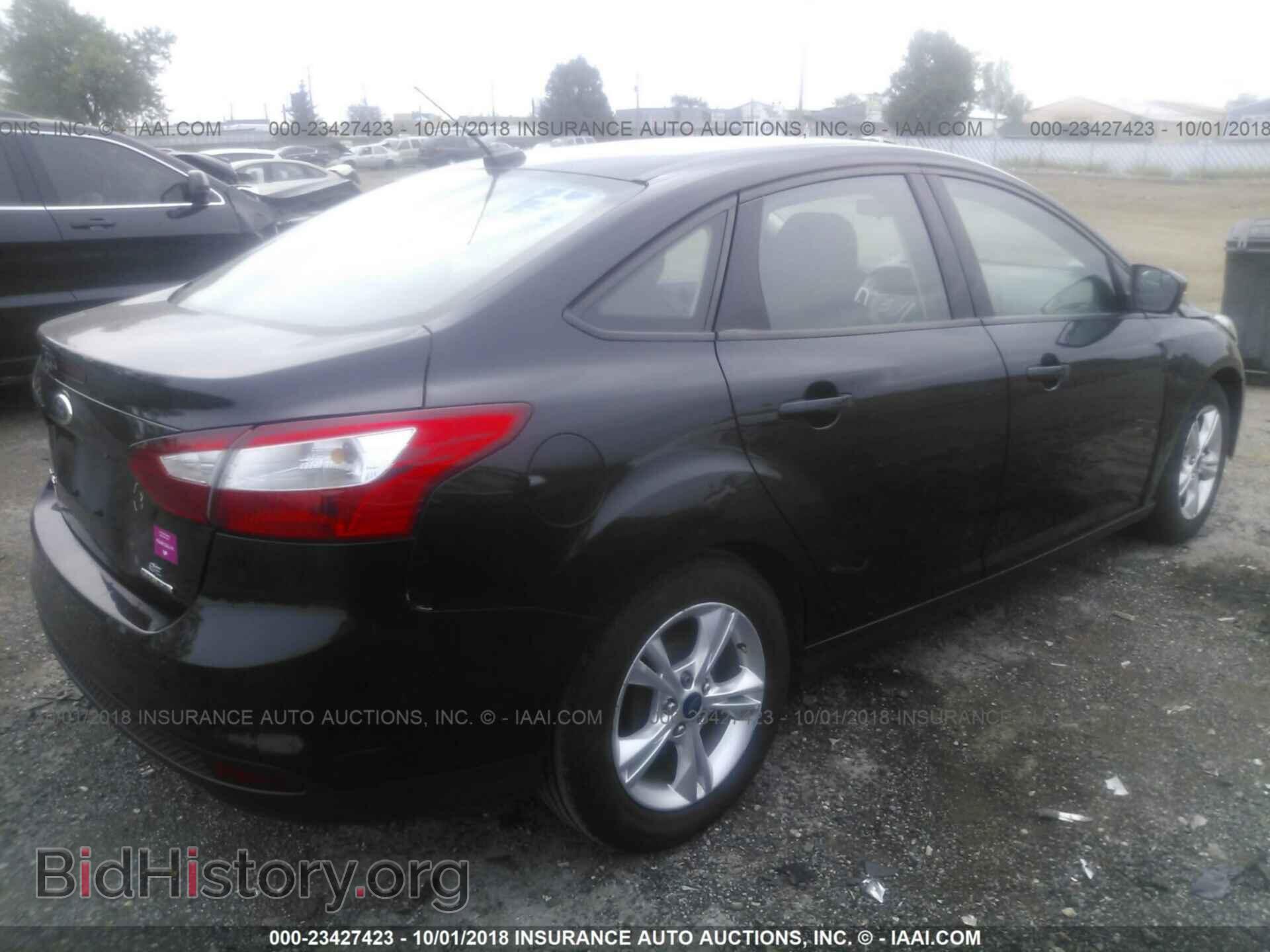 2014 Ford Focus - VIN: 1FADP3F21EL369341 - Photo 4