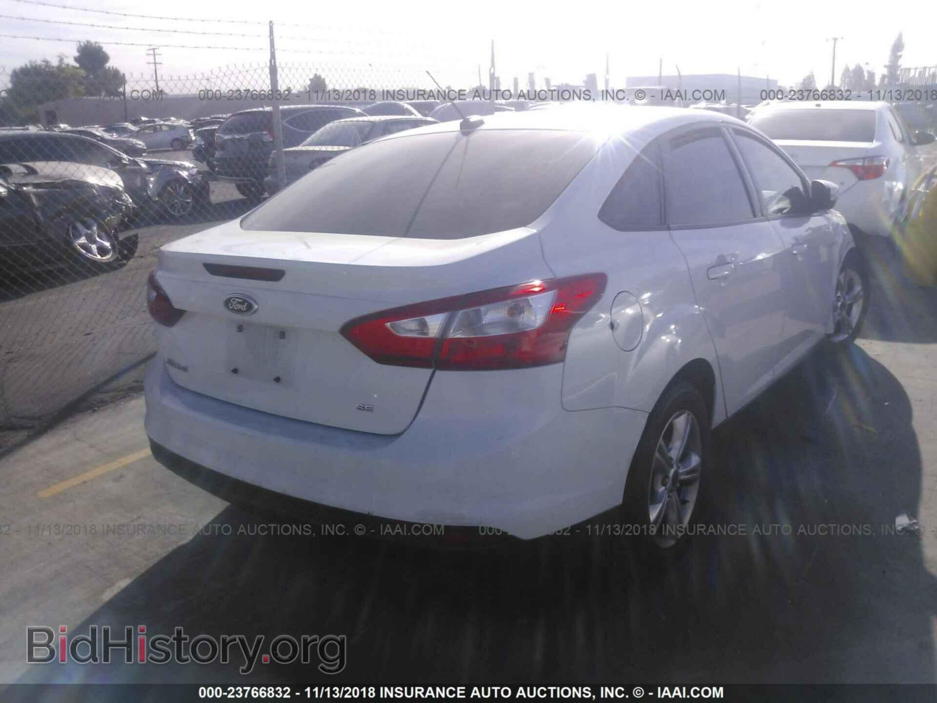 2014 Ford Focus - VIN: 1FADP3F2XEL163418 - Photo 4