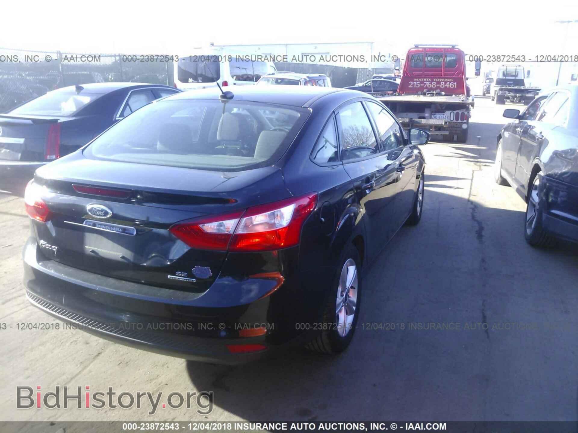 2014 Ford Focus - VIN: 1FADP3F21EL218211 - Photo 4