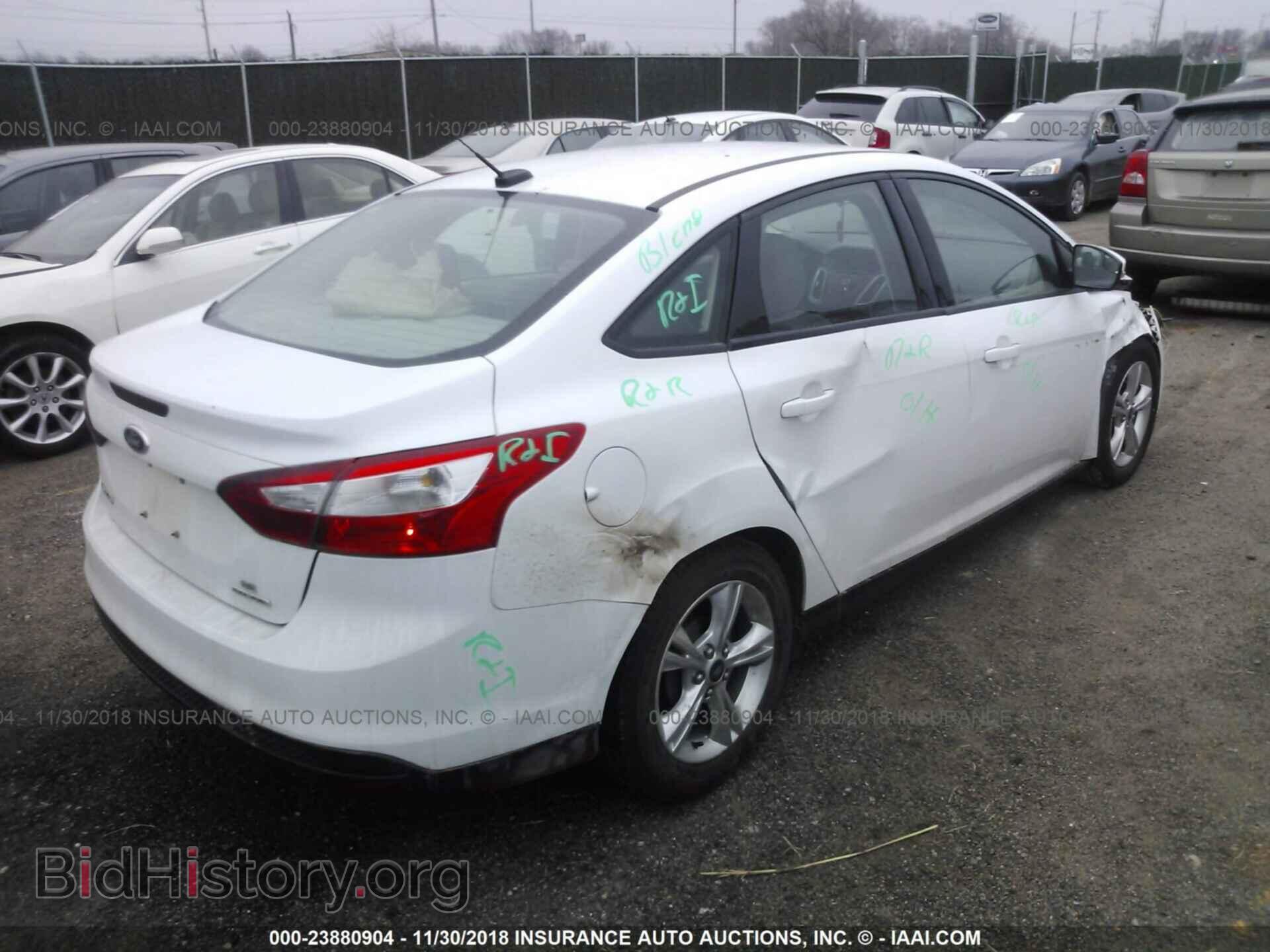 2014 Ford Focus - VIN: 1FADP3F22EL109899 - Photo 4