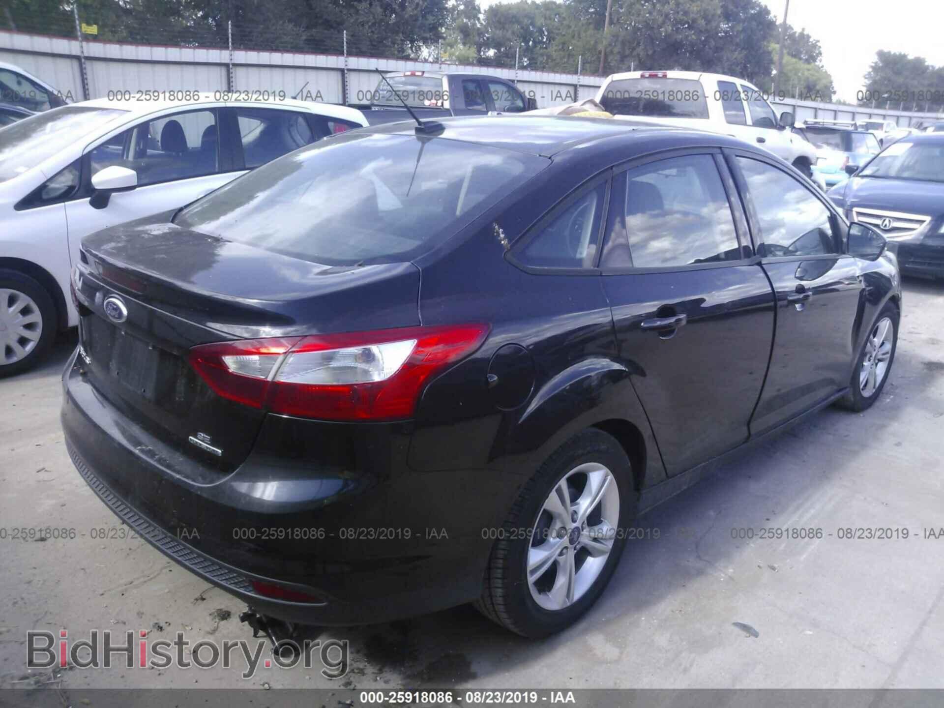 2014 Ford Focus - VIN: 1FADP3F21EL131215 - Photo 4