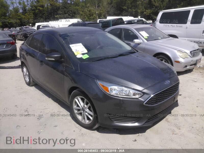 2016 Ford FOCUS SE (VIN 1FADP3F2XGL376971) — photo 1 of 10, IAAI, damage: rear