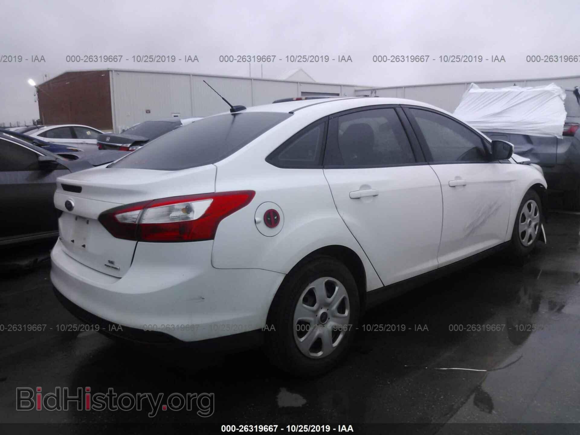2014 Ford Focus - VIN: 1FADP3F26EL130058 - Photo 4