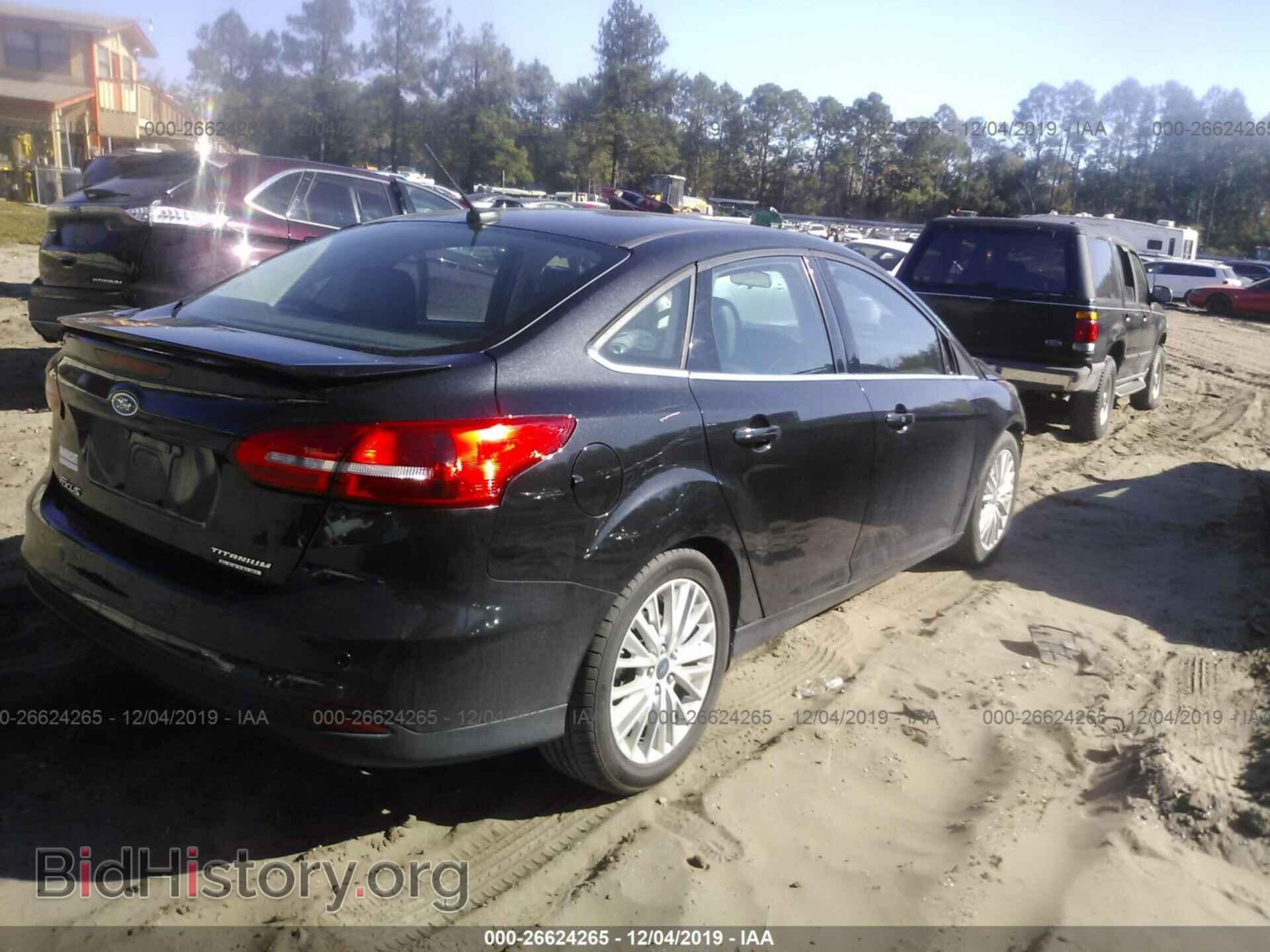 2015 Ford Focus - VIN: 1FADP3J23FL304547 - Photo 4