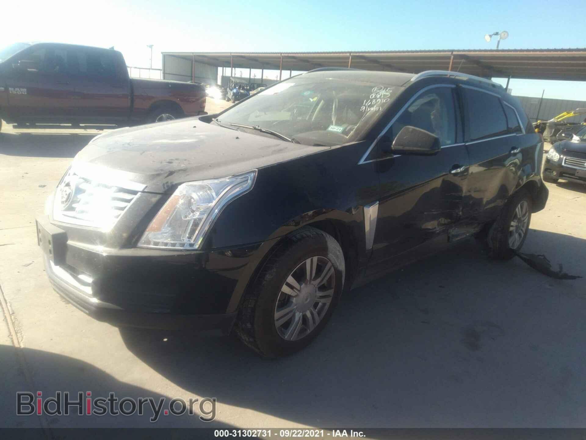 2014 CADILLAC SRX - VIN: 3GYFNBE30ES653335 - Фото 2