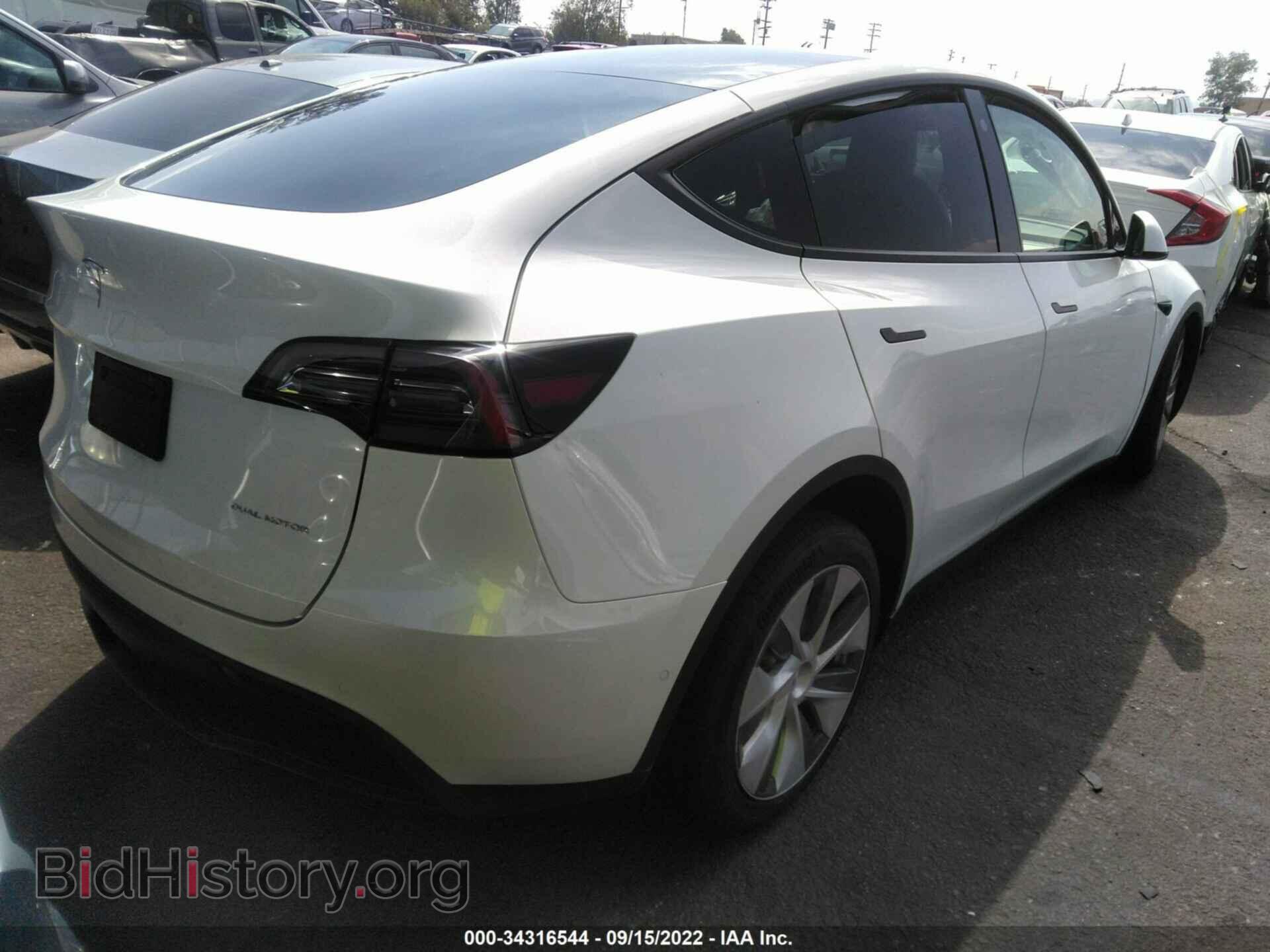 2022 TESLA MODEL Y - VIN: 7SAYGAEE6NF358692 - Photo 4