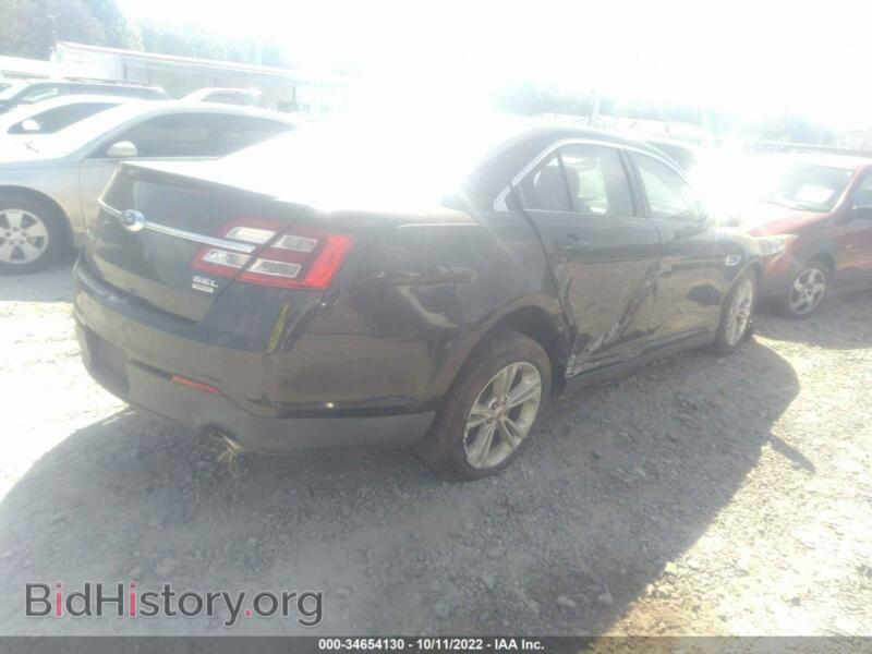 2014 Ford TAURUS (VIN 1FAHP2E93EG164624) — photo 4 of 11