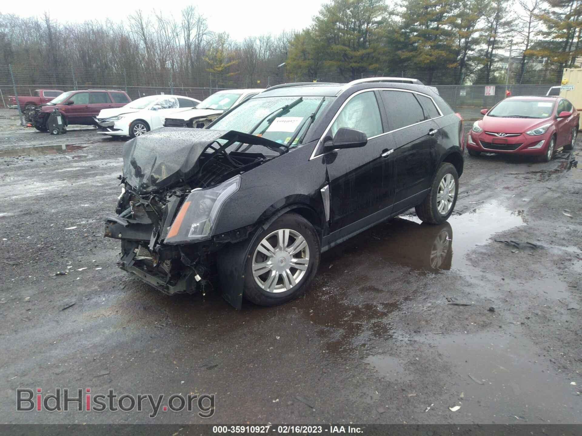 2014 CADILLAC SRX - VIN: 3GYFNBE39ES525739 - Фото 2