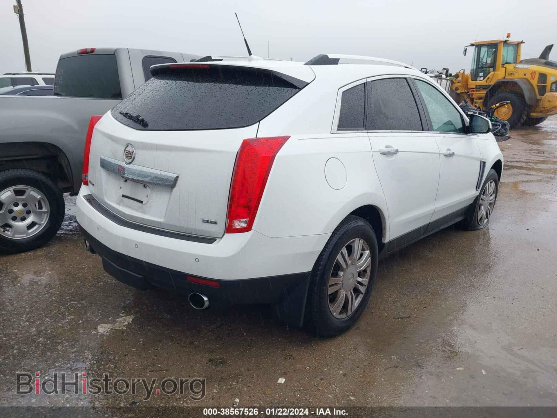 2014 CADILLAC SRX - VIN: 3GYFNBE39ES660879 - Фото 4