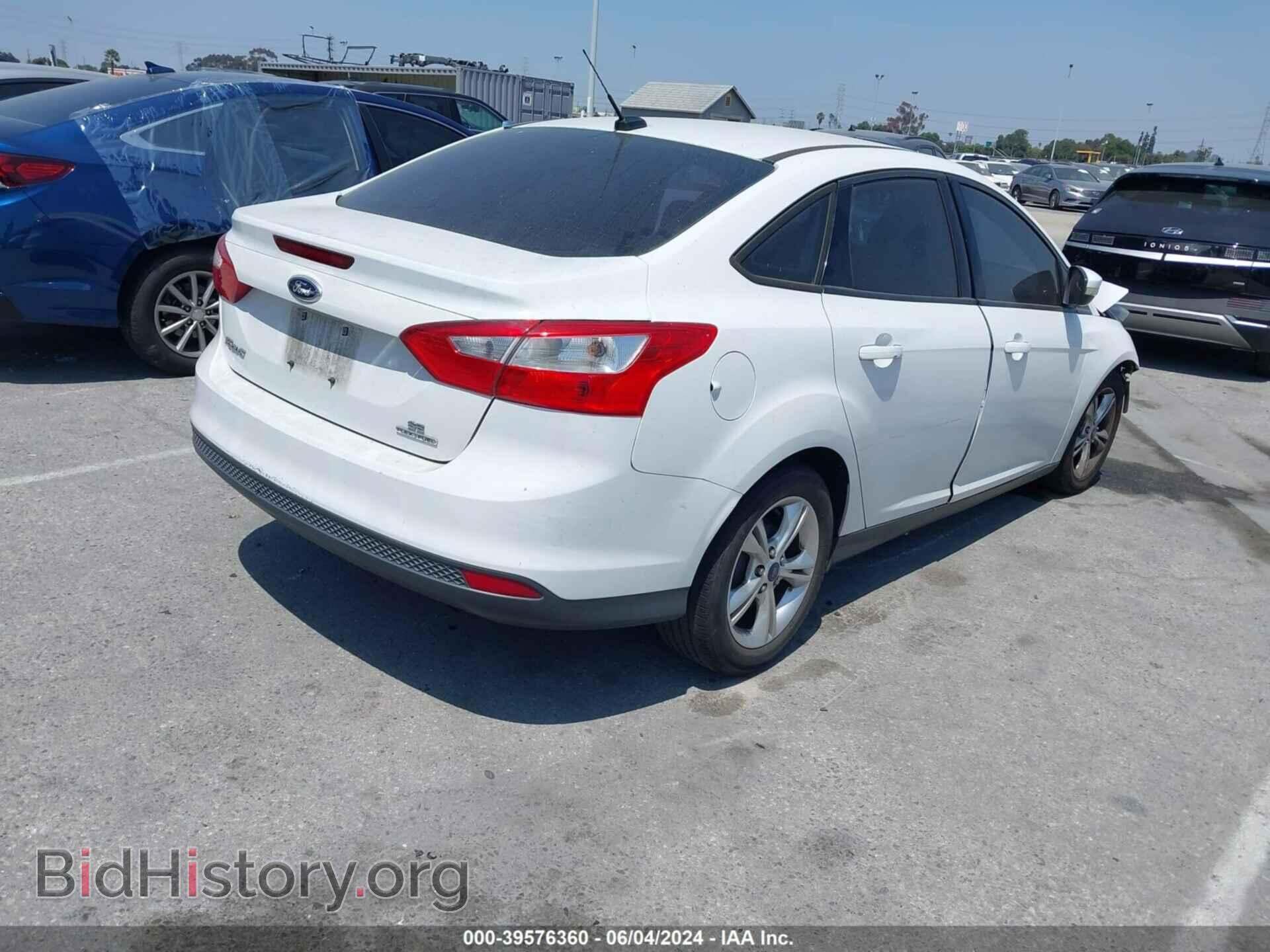 2014 FORD FOCUS - VIN: 1FADP3F21EL277114 - Photo 4