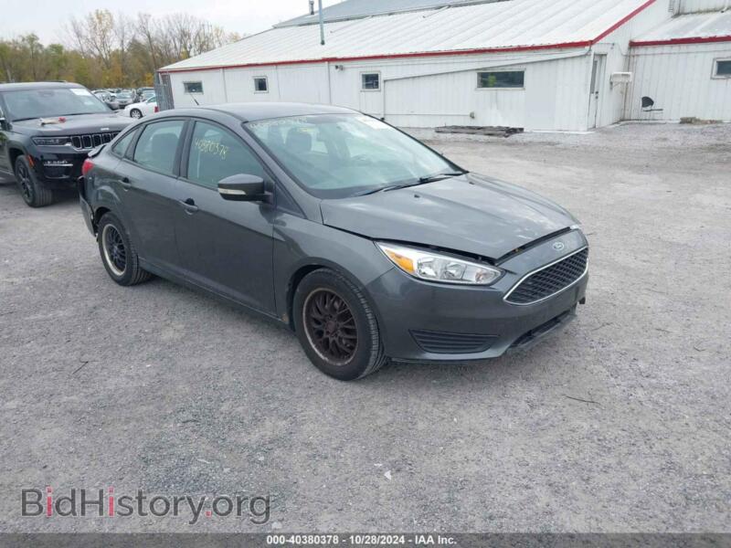 2016 Ford FOCUS SE (VIN 1FADP3F2XGL280855) — фото 1 из 16, IAAI, повреждение: левая задняя часть