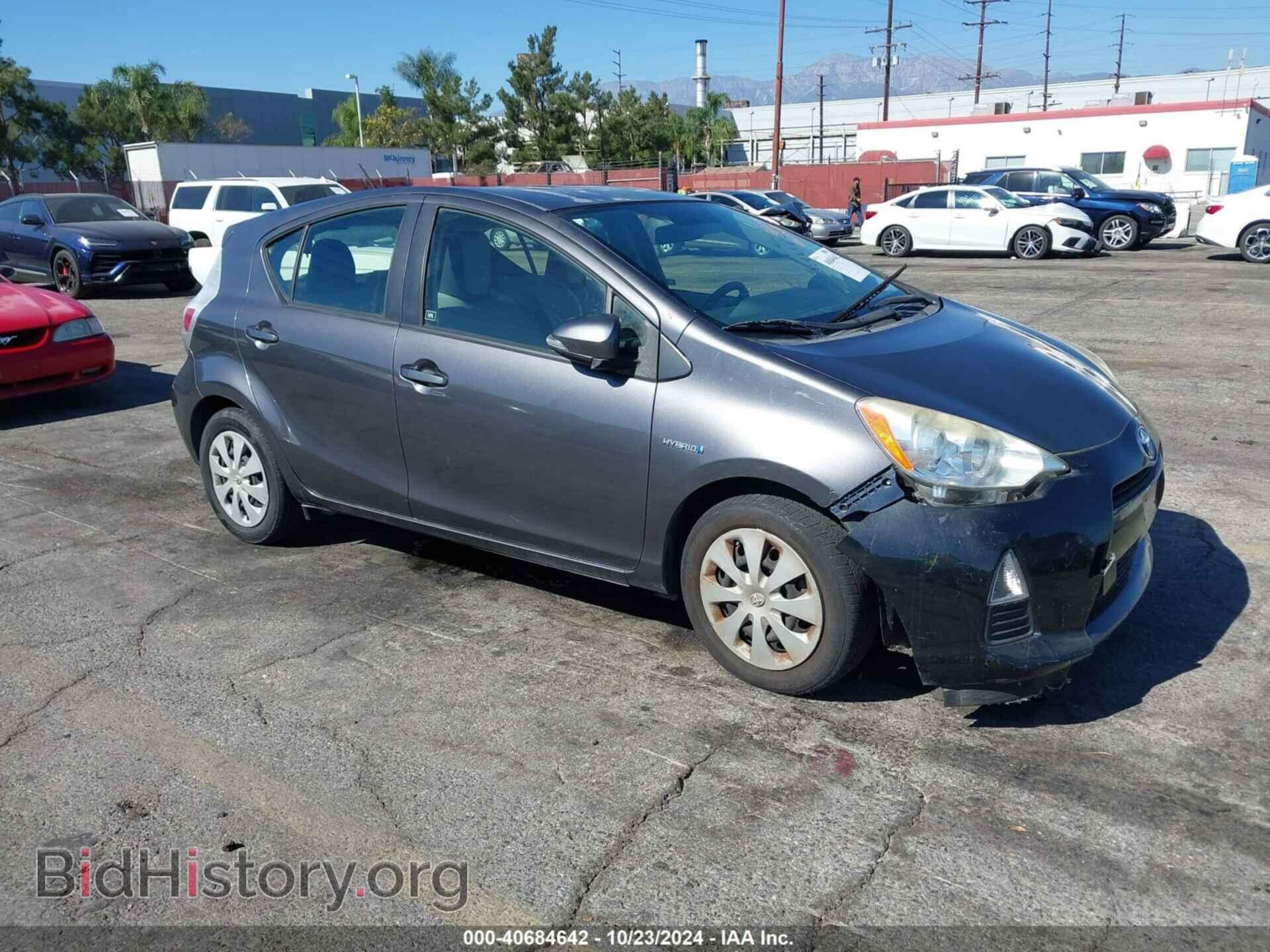 Фотография JTDKDTB34E1066557 - TOYOTA PRIUS C 2014