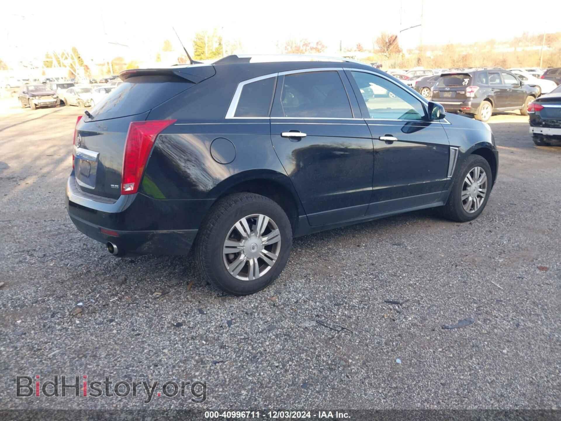 2013 CADILLAC SRX - VIN: 3GYFNCE3XDS529285 - Фото 4
