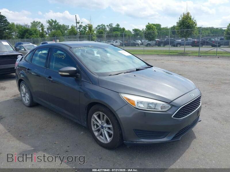 2016 Ford FOCUS SE (VIN 1FADP3F29GL402850) — фото 1 из 11, IAAI, повреждение: задняя часть