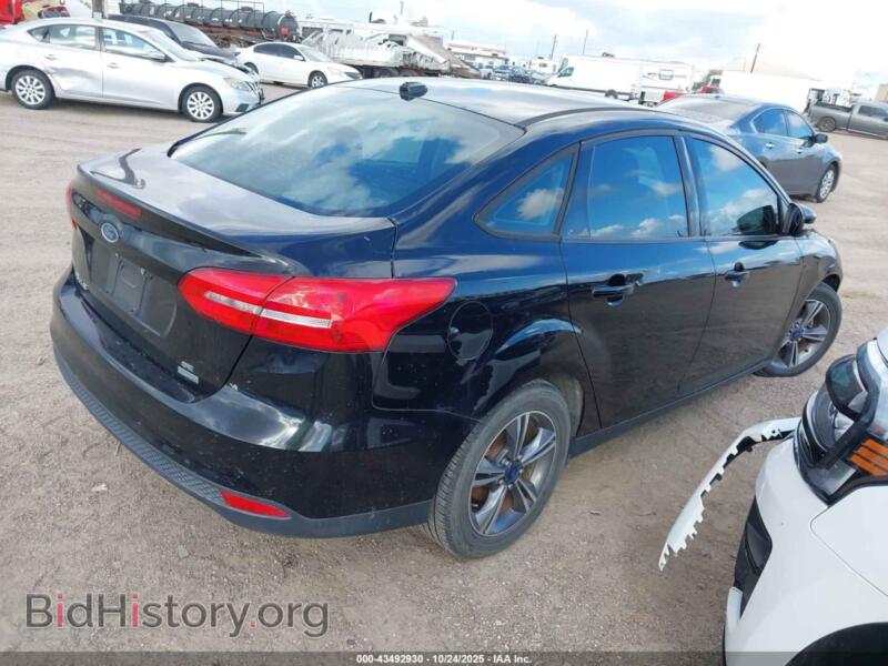 2016 Ford FOCUS (VIN 1FADP3FE8GL202679) — фото 4 из 11