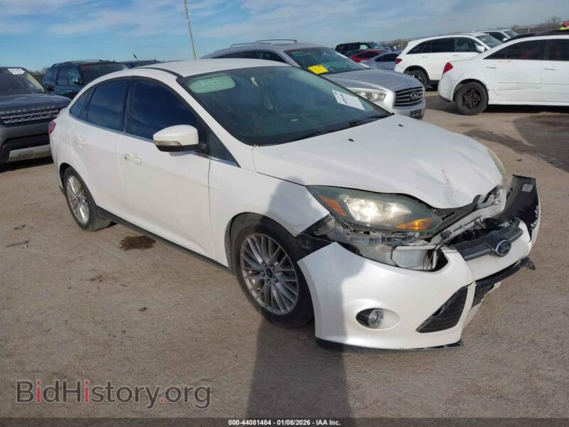 2014 Ford FOCUS Titanium (VIN 1FADP3J20EL403471) — photo 1 of 17, IAAI, damage: front end