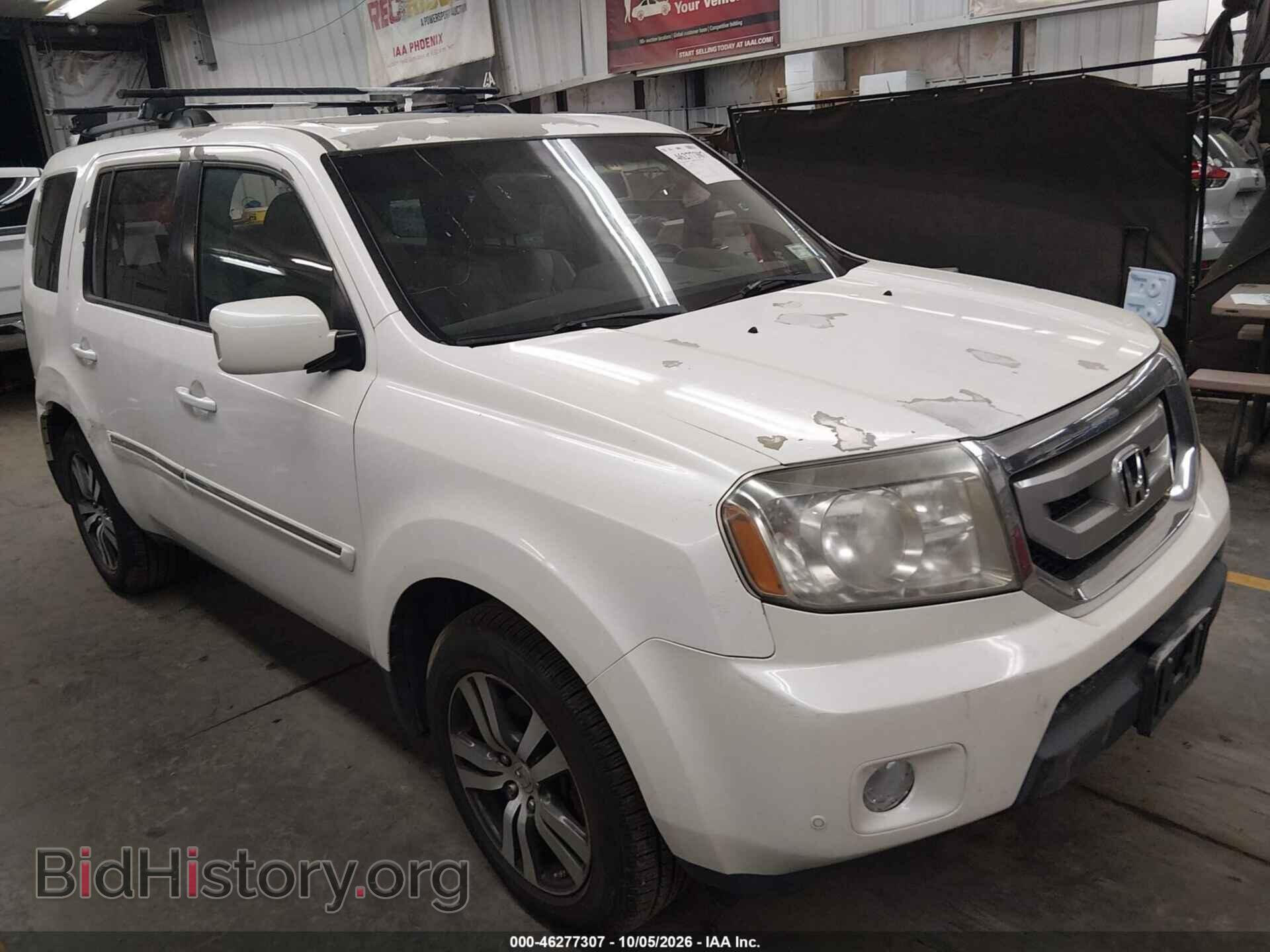 2011 Honda PILOT Touring (VIN 5FNYF4H96BB093154) — photo 1 of 16, IAAI, damage: roof