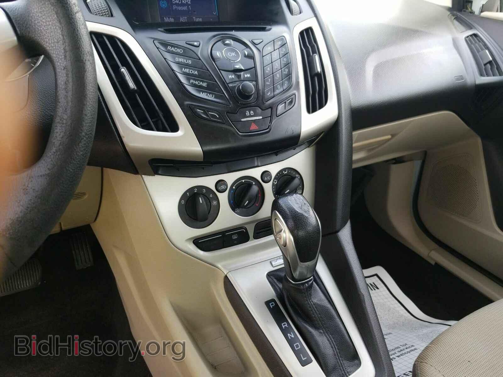 2014 Ford Focus - VIN: 1FADP3F24EL104333 - Photo 4