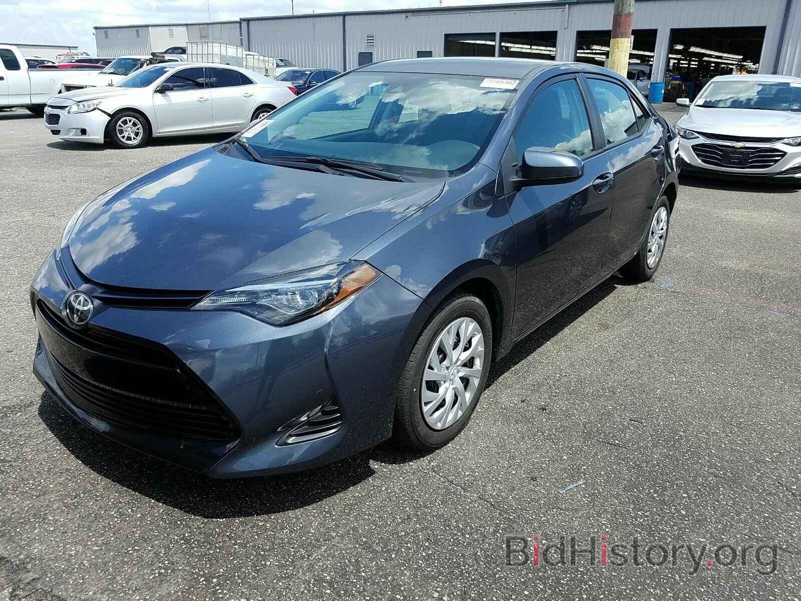 Photo 5YFBURHE2KP898451 - Toyota Corolla LE 2019