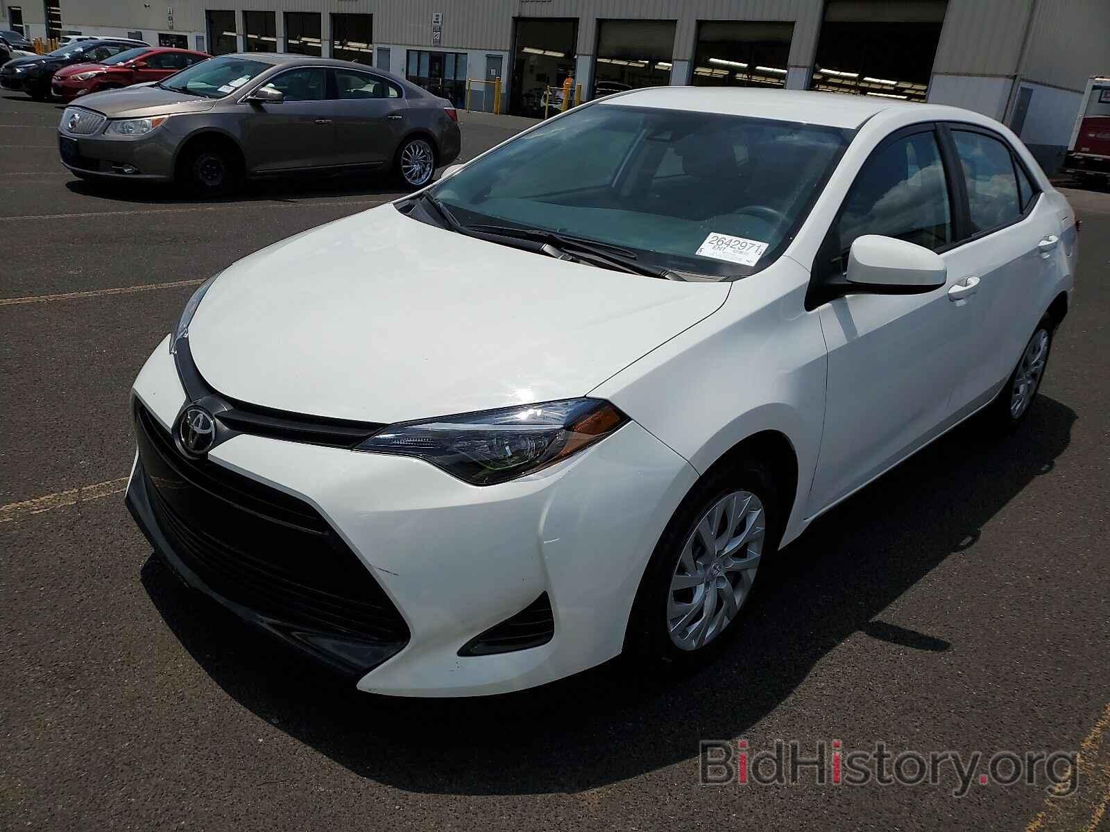 Photo 5YFBURHE9KP928853 - Toyota Corolla LE 2019