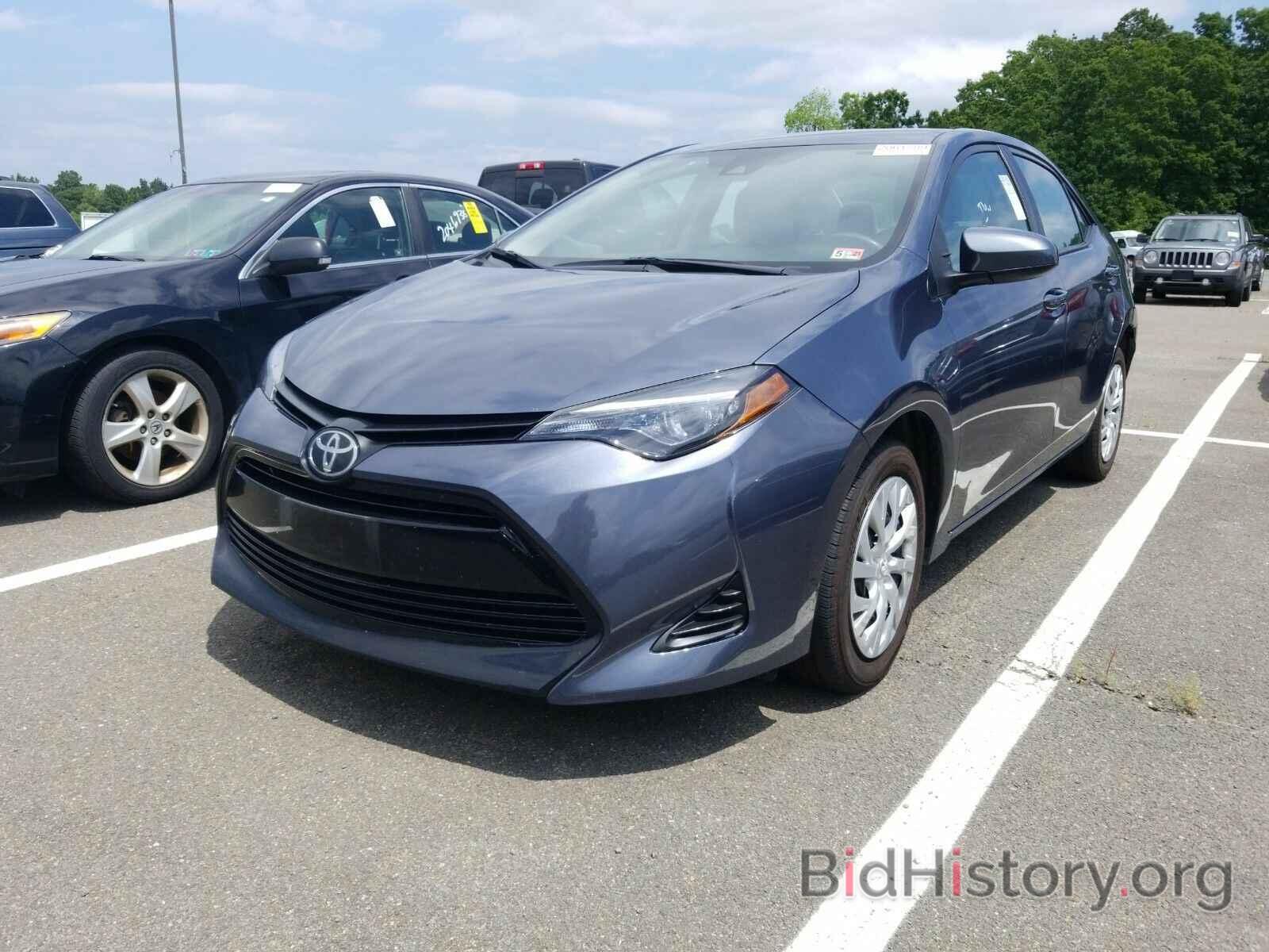 Photo 5YFBURHE9KP946284 - Toyota Corolla LE 2019