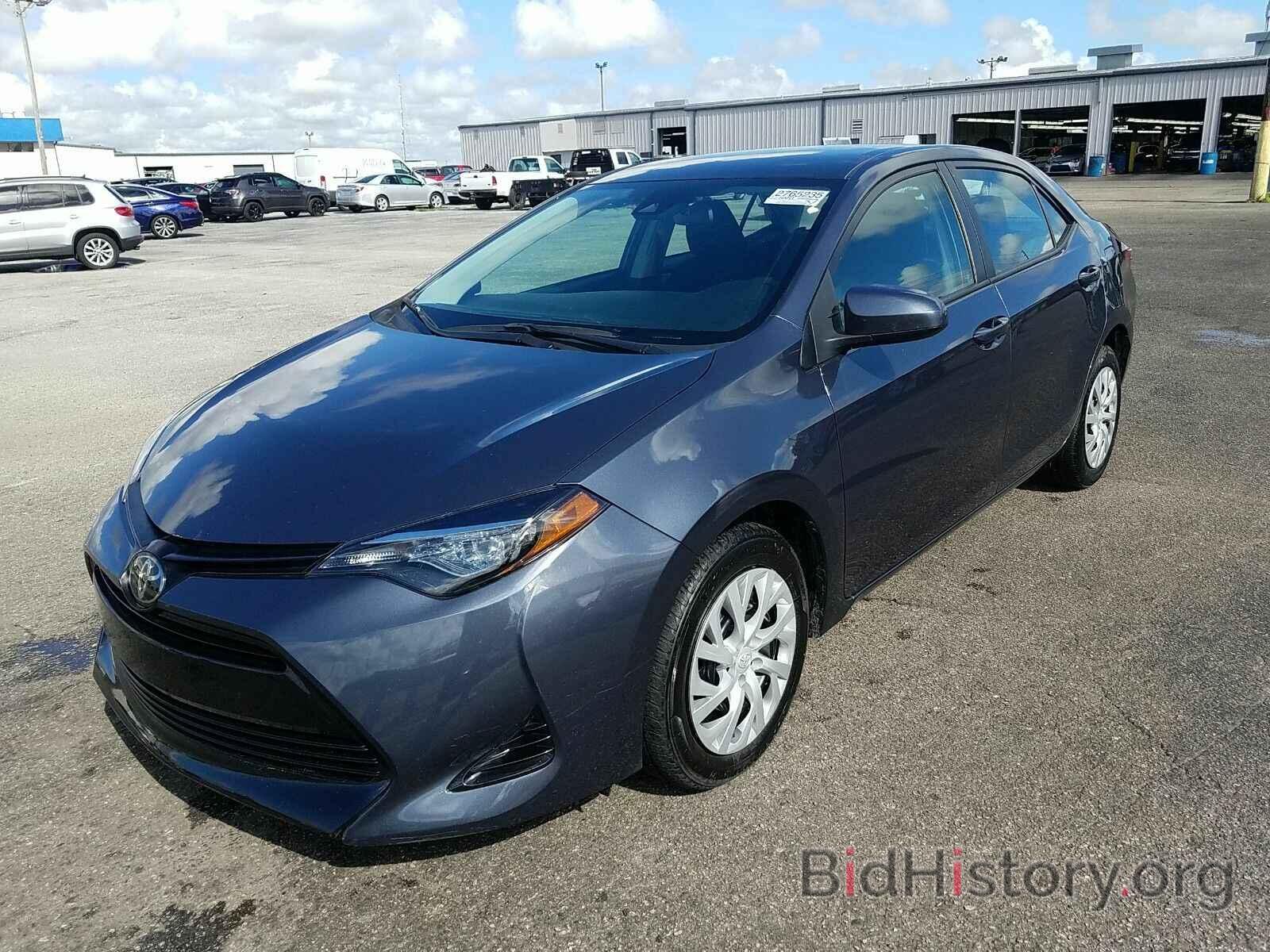 Photo 5YFBURHE3KP878693 - Toyota Corolla LE 2019