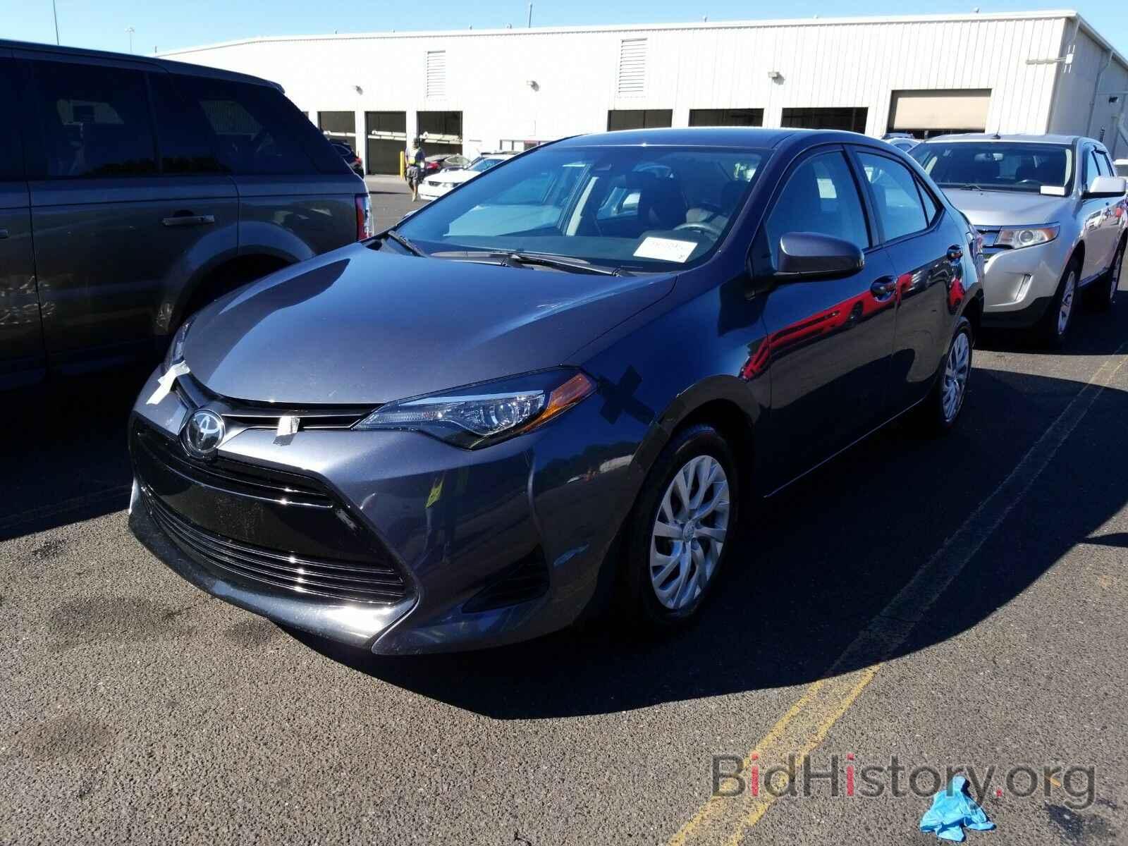 Photo 5YFBURHE9KP887060 - Toyota Corolla LE 2019