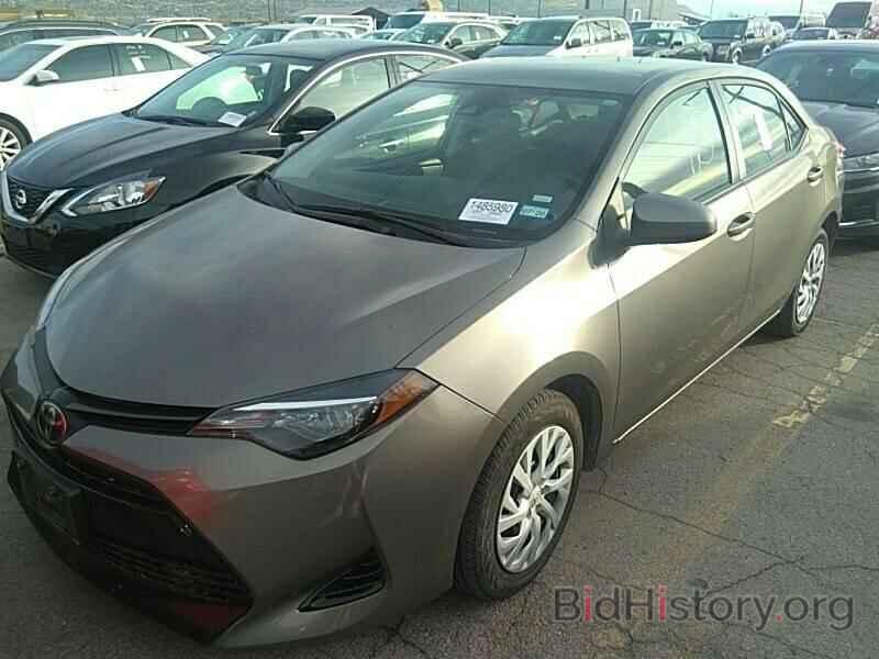 Photo 5YFBURHE2KP875221 - Toyota Corolla LE 2019