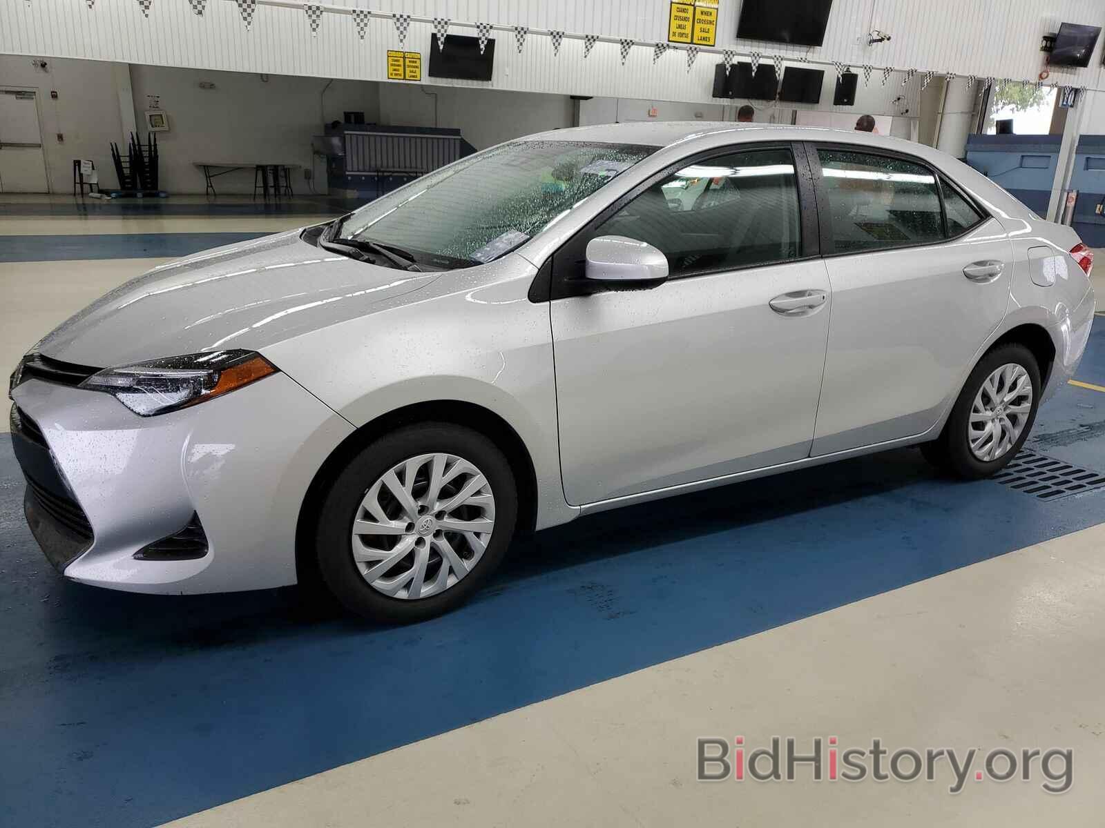 Photo 5YFBURHE9KP885406 - Toyota Corolla LE 2019